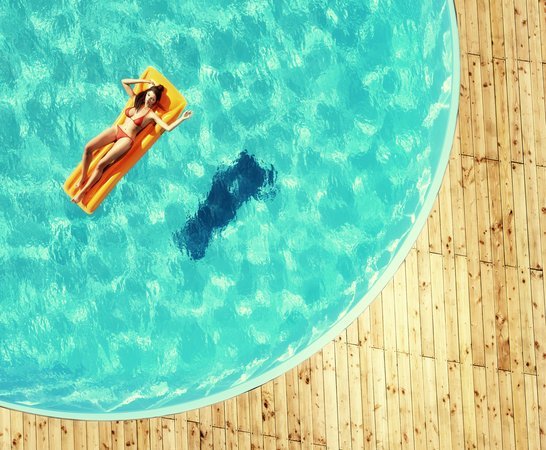 Number 4 Hair Care Woman Floating in Pool Shark Awareness Week