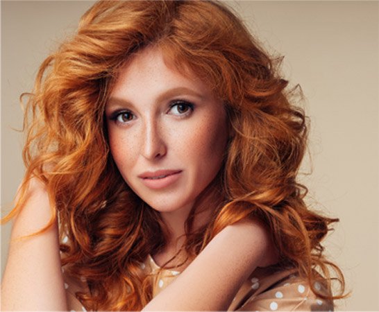 Woman with bigger, brighter, shinier hair in 2023