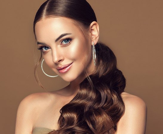 Woman taking selfie after using our top styling tips