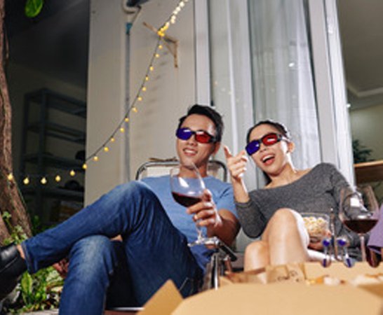 Couple watching a movie together in 3D|
