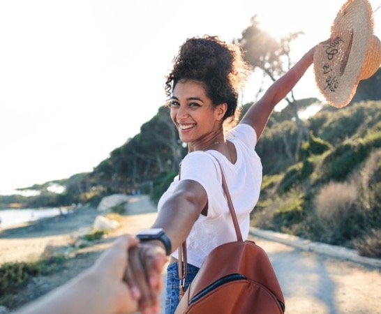 vegan hair products - lady walking and holding hand|vegan hair care products